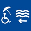 Pictogramme d’une personne en chaise roulante sur la plage.