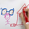Un enfant dessine une maison et une paire de lunettes