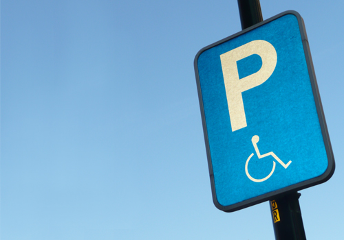 Sign showing a parking space for a disabled person.